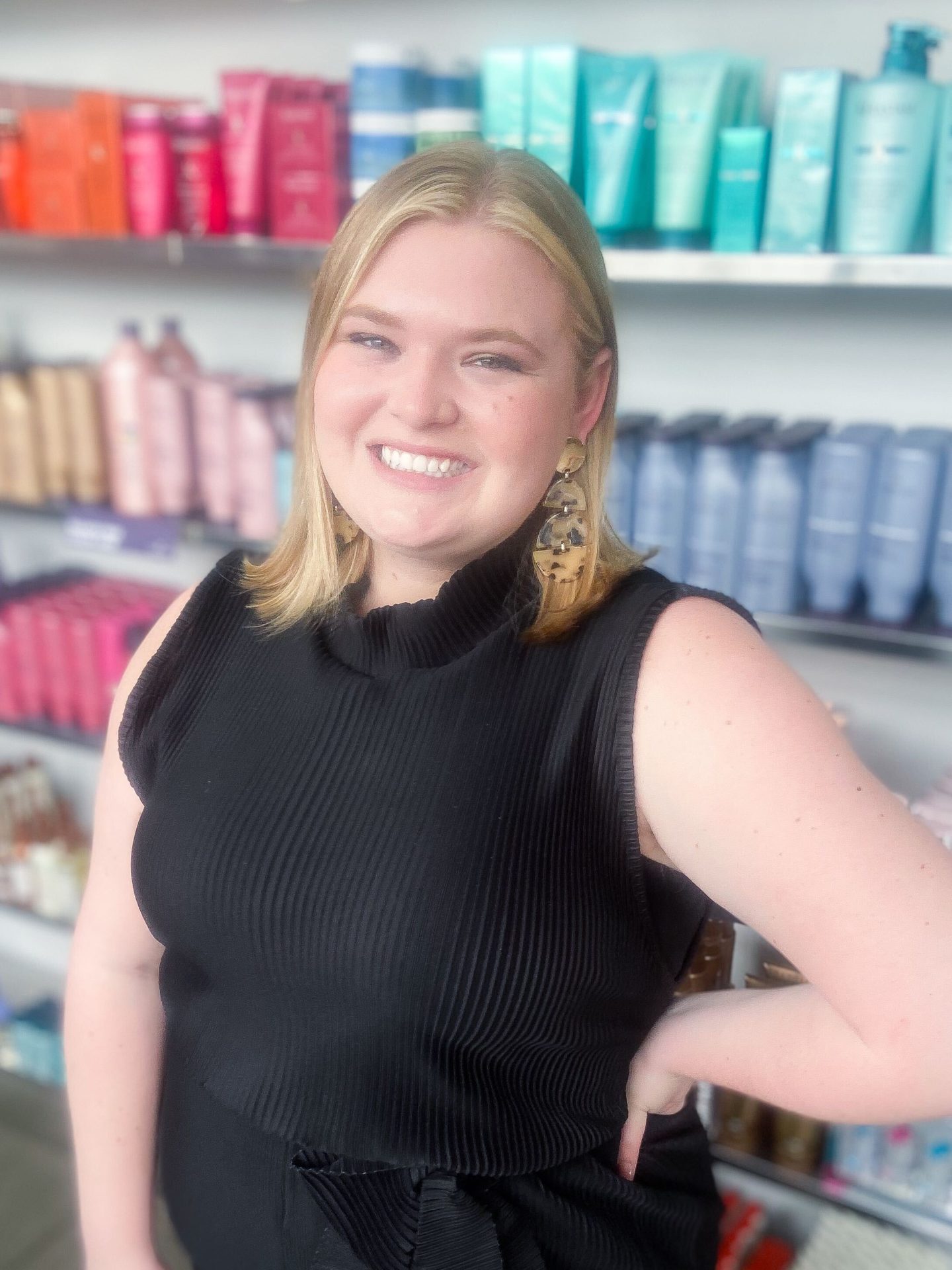 headshot of Hailie Poppell - Marketing Strategist & Boutique Coordinator